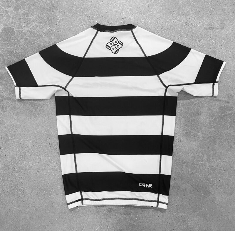 "INSTITUTIONALIZED" Short Sleeve Rashguard - Image 2